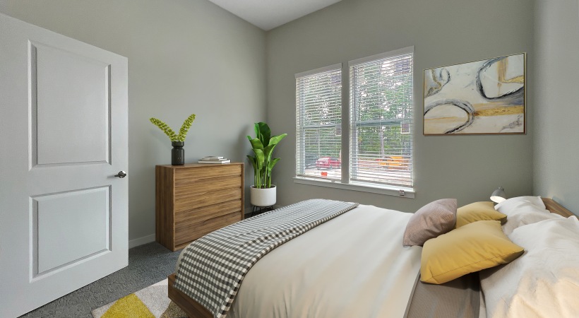 Primary bedroom with modern furniture.