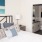 Bedroom with natural lighting and high ceilings
