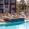 Resort-style swimming pool with lounge seating