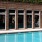 Resort-style swimming pool with lounge seating