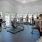 rendering of fitness center showing views of the pool area and ample equipment